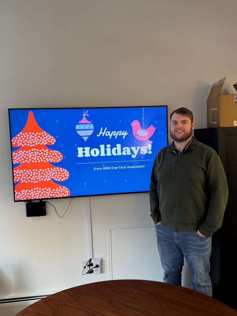 ARM EnerTech Associates holiday greeting on a SmartSign2Go office screen